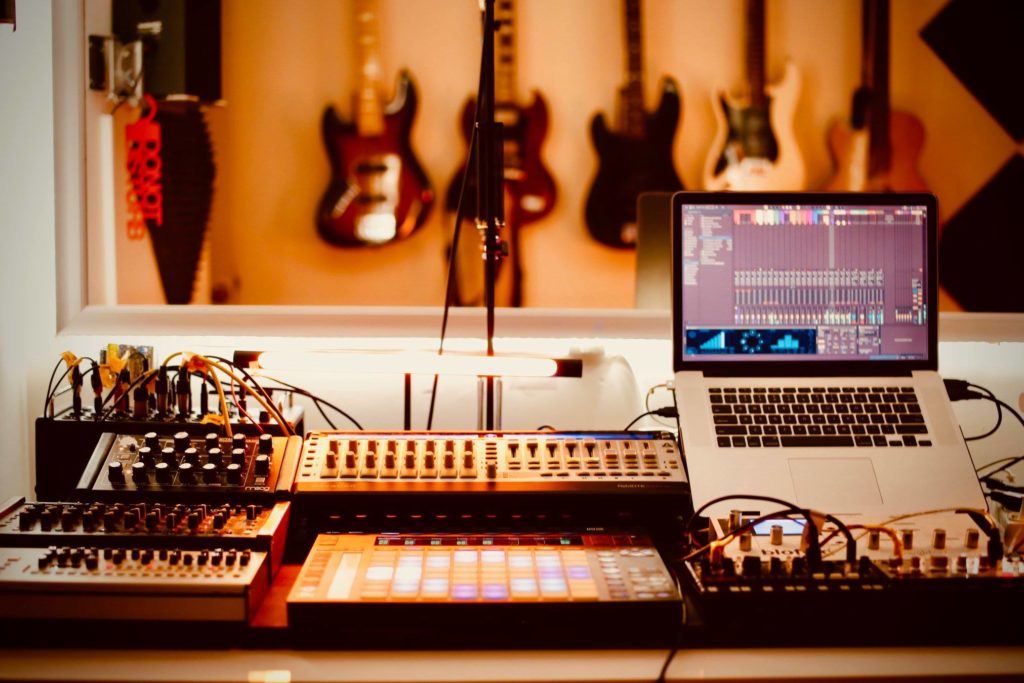 Home Recording Studio with Guitars, Laptop, Midi Controller and Mixer