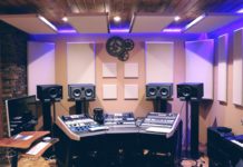 recording studio with monitors, mixing console.