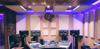 recording studio with monitors, mixing console.