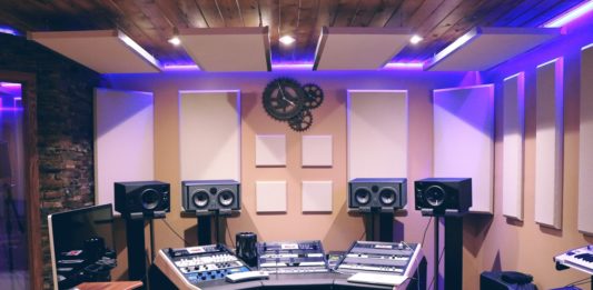 recording studio with monitors, mixing console.