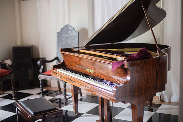 grand piano with bench and chair