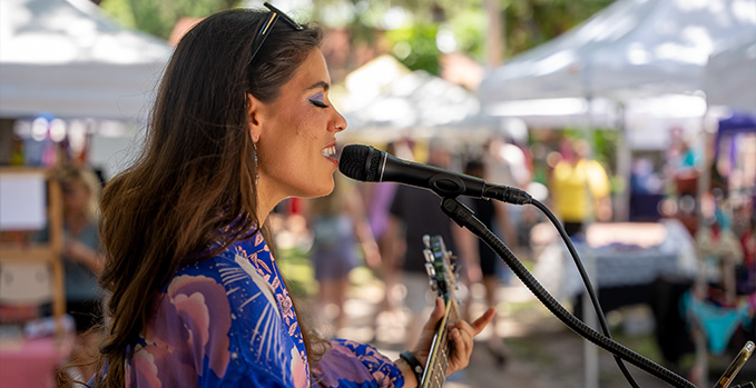 Female singer performing with Sterling P30 Active Microphone