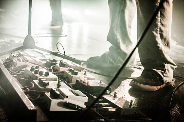 Image showing several types of guitar modulation pedals in use on stage