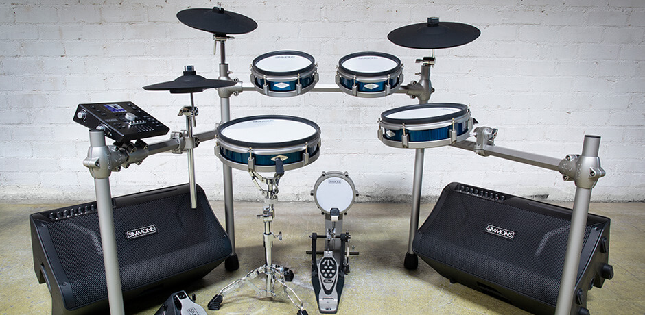 image of electronic drums with a pair of Simmons DA2112 drum amplifiers