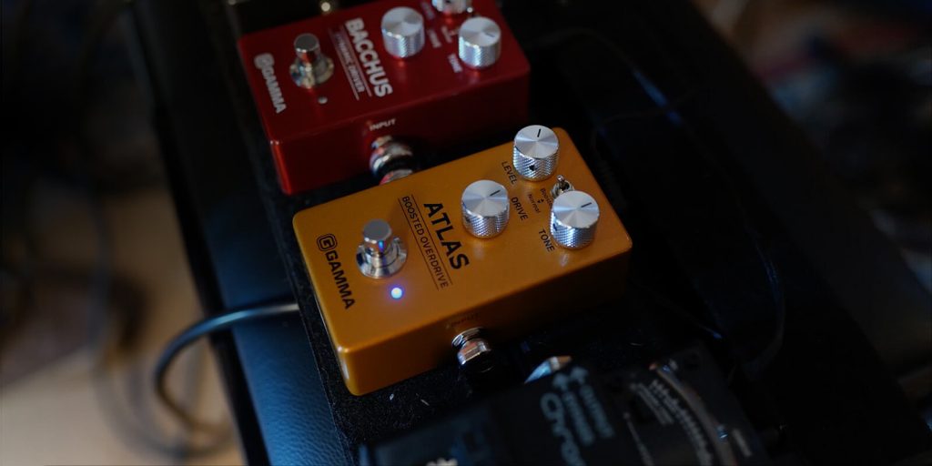 Image of the GAMMA Atlas Overdrive pedal on a pedalboard with other effects