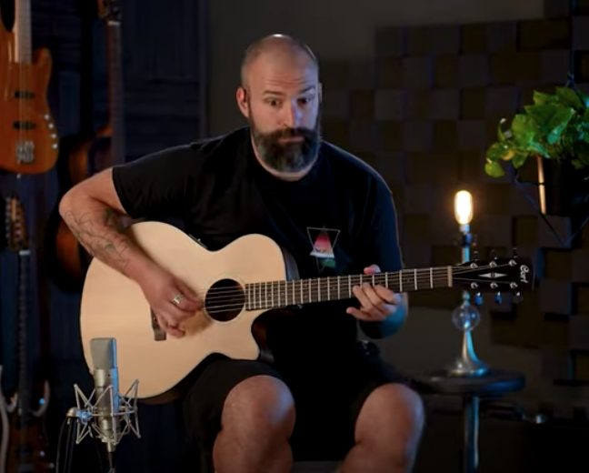 image of acoustic guitarist in studio